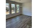 Bright dining area with hardwood flooring and plenty of natural light from the large windows at 208 Saratoga Dr, Acworth, GA 30102