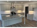 Modern kitchen features granite countertops, gray cabinets, and stainless steel appliances at 208 Saratoga Dr, Acworth, GA 30102