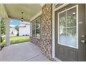 Open front porch view showcasing the home's exterior, window details, and covered entry area at 2450 Overlook Ave, Lithonia, GA 30058