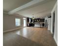 Spacious kitchen featuring dark cabinets, a large island, and a tile backsplash at 3488 Woodshade Dr, Loganville, GA 30052