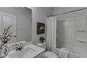 Clean bathroom with shower-tub combination, toilet and vanity at 1240 Ainsworth Aly # 39, Sugar Hill, GA 30518