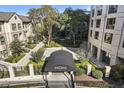 Elevated view of building entrance, revealing the landscaped courtyard and walkways surrounding the residence at 3475 Oak Valley Rd # 1850, Atlanta, GA 30326