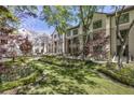 Picturesque courtyard featuring lush green lawn, mature trees, and meticulously maintained landscaping at 3475 Oak Valley Rd # 1850, Atlanta, GA 30326