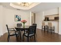 Elegant dining area with a round table, stylish chairs, and a view of the kitchen at 3475 Oak Valley Rd # 1850, Atlanta, GA 30326