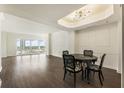 Bright dining room features dark hardwood floors and a modern light fixture at 3475 Oak Valley Rd # 1850, Atlanta, GA 30326