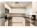 Efficient kitchen showcases modern appliances, granite countertops, and ample cabinet space at 3475 Oak Valley Rd # 1850, Atlanta, GA 30326