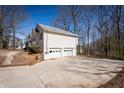 Spacious two-car garage and large driveway providing ample parking space at 2192 Stenger Rd, Douglasville, GA 30135