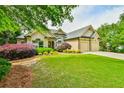 Beautiful home with lush landscaping, two-car garage, and inviting curb appeal at 3435 Vista Creek Dr, Dacula, GA 30019