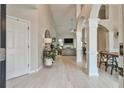 Open-concept foyer with hardwood floors, high ceilings, and modern lighting fixtures at 3435 Vista Creek Dr, Dacula, GA 30019
