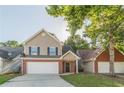 Two-story home featuring a brick-and-vinyl facade with an attached garage and a well-manicured front lawn at 1720 New Orleans Way, Mcdonough, GA 30252