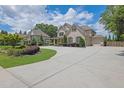 A traditionally styled home with three-car garage and mature landscaping at 2205 Beaver Shop Ne Rd, Marietta, GA 30066