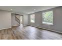 Bright living room featuring new flooring, freshly painted walls, and an abundance of natural light at 1492 Harbins Rd, Norcross, GA 30093
