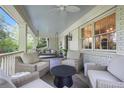 Inviting front porch featuring comfortable seating and a swing at 3251 Pinestream Nw Rd, Atlanta, GA 30327