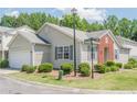 Charming single-story home with a 1-car garage, gray siding and brick accents at 331 Windcroft Nw Ln, Acworth, GA 30101