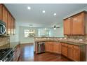Well-appointed kitchen with stainless steel appliances, granite countertops, and wooden cabinets at 3692 Lambert Ne Ln, Brookhaven, GA 30319