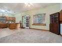 Open kitchen area with ample space for dining and meal preparation, featuring an exterior door and large window at 1888 Kelvin Dr, Lawrenceville, GA 30043