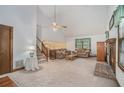Bright living room showcasing a fireplace, comfortable seating, and a staircase leading to upper level at 1888 Kelvin Dr, Lawrenceville, GA 30043
