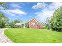 Beautiful single-story brick house with a spacious front yard and well-kept landscaping at 516 Main St, Hiram, GA 30141
