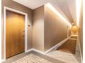 Hallway with neutral wall coverings, carpet, and multiple doors at 3300 Windy Ridge Se Pkwy # 718, Atlanta, GA 30339