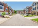 Picturesque street featuring lovely townhomes with attached garages, complemented by well-maintained landscaping at 3799 Chattahoochee Summit Se Dr # 5, Atlanta, GA 30339