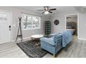 Bright living room featuring a large window and comfortable seating at 551 Floyd Se Dr, Smyrna, GA 30082