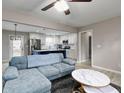 Open concept living room featuring a comfortable sofa and modern decor at 551 Floyd Se Dr, Smyrna, GA 30082