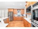 Bright kitchen boasts stainless steel appliances, custom cabinetry, and a large island with white countertops at 1967 Mason Mill Rd, Decatur, GA 30033
