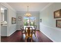 Traditional dining room with hardwood floors, chandelier, and classic decor at 1274 Ridge Vista Ct, Lawrenceville, GA 30043