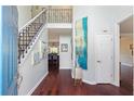 Elegant foyer with hardwood floors, staircase with iron railings, and stylish decor at 1274 Ridge Vista Ct, Lawrenceville, GA 30043