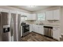 Kitchen featuring stainless steel appliances, gas range, and laminate countertops at 5786 Longbow Dr, Stone Mountain, GA 30087