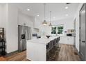 Bright, spacious kitchen features a large island, stainless appliances, and modern finishes at 3 Becker Nw Pl, Atlanta, GA 30307