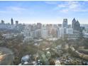 Expansive aerial view capturing the impressive Atlanta skyline and lush greenery of the surrounding parks at 199 14Th Ne St # 2312, Atlanta, GA 30309