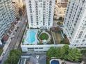Luxurious rooftop pool and garden area surrounded by modern buildings in a vibrant city setting at 199 14Th Ne St # 2312, Atlanta, GA 30309