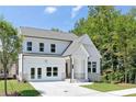 Two-story home with white siding, an attached garage, and a nicely maintained lawn at 3062 Cambridge Mill St, Acworth, GA 30102