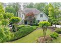 Landscaped front yard showing the home's facade, well-manicured lawn, and verdant trees at 4101 Rickenbacker Ne Dr, Atlanta, GA 30342