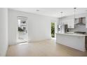 Bright living room and kitchen area with stainless steel appliances at 775 Juniper Ne St # 334, Atlanta, GA 30308