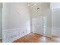 Elegant entryway featuring detailed molding and hardwood floors at 1480 Holly Brook Rd, Snellville, GA 30078