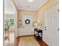 Inviting foyer features hardwood floors, decorative rug, and a glimpse of the dining area at 3365 Buffington Ln, Cumming, GA 30040