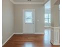 Bright entryway boasting gleaming hardwood floors, fresh paint, and modern trim at 3399 Lake Frg, Fairburn, GA 30213
