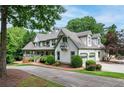 Spacious two-story home with a three-car garage, well-maintained landscaping, and a brick driveway at 5102 Chastleton Dr, Stone Mountain, GA 30087