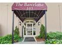 The Barcelona building entrance features covered entryway, attractive exterior lighting, and well-maintained landscaping at 395 Pharr Ne Rd # 103, Atlanta, GA 30305