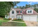 Charming two-story home featuring a two-car garage and well-maintained landscaping at 4615 Thermal Ct, Douglasville, GA 30135