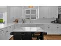 Bright kitchen featuring white cabinets, white countertops, and stainless appliances at 1294 Parkview Nw Ln, Kennesaw, GA 30152