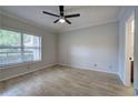 Light-filled bedroom with hardwood floors, ceiling fan, and large window with blinds at 2110 River Green Nw Dr # 2110, Atlanta, GA 30327