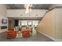 Spacious lobby with a cozy seating area, modern lighting, and a staircase provides a welcoming entrance at 711 Cosmopolitan Ne Dr # 338, Atlanta, GA 30324