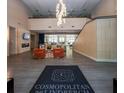 Inviting lobby area with modern furnishings, a stylish chandelier, and a welcoming atmosphere for residents and guests at 711 Cosmopolitan Ne Dr # 338, Atlanta, GA 30324