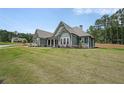 Charming home featuring a spacious yard and inviting front porch at 485 Discovery Lake Dr, Fayetteville, GA 30215