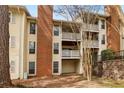 Back of the home showing upper and lower decks and brick chimney at 6806 Glenridge Dr # E, Atlanta, GA 30328