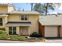 Charming townhome with attached garage and well-maintained landscaping at 6806 Glenridge Dr # E, Atlanta, GA 30328