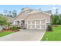 Inviting single Gathering home with a 2 car garage, neutral siding, stone accents, manicured lawn, and sidewalk at 169 Hickory Bluffs Pkwy, Canton, GA 30114